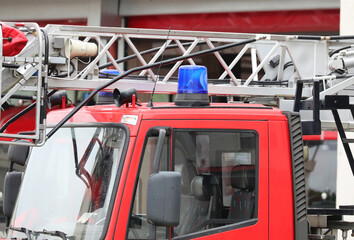 blue siren and the ladder of the fire truck without people