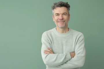 Warm and Welcoming Portrait of a Middle-Aged Man in Pastel Green Monotone Background for Print Design