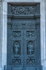 Ornate bronze door with intricate bas-relief sculptures