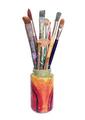 A handpainted glass jar with a variety of dirty, used artist paint brushes.