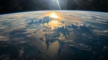 Earth from space with sunlight illuminating the atmosphere