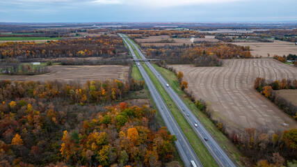 Aerial photo of the fall foliage surrounding the New York State Thruway in the Town of Tyre, Seneca County, New York State, October 2024.	