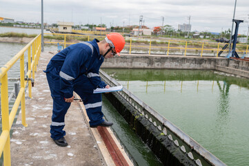 Water plant maintenance technicians, mechanical engineers check the control system at the water treatment plant.