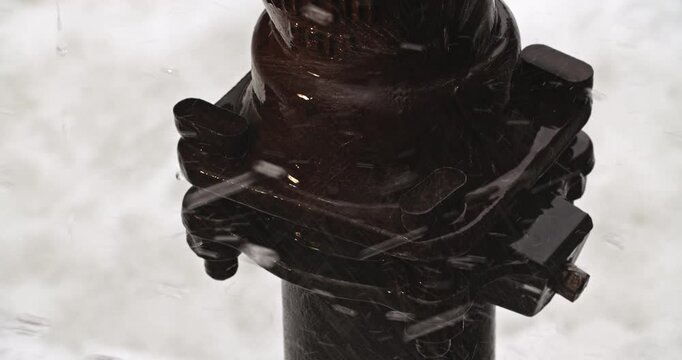 Close-up on a pipe fixture surrounded by splashing and sloshing water, with audio.
