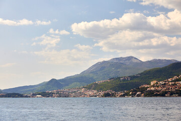 Fototapeta premium Landscape with blue sea and green mountains