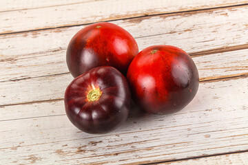 Black ripe juicy organic tomato