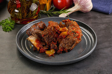 Baked beef ribs with vegetables