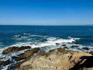 View of sea crashing on the rocks