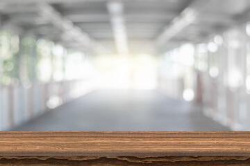 Wooden board empty table background. On the blurred background of the empty office room