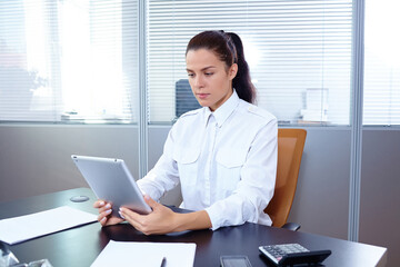 Young businesswoman sitting at workplace