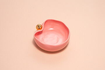 pink porcelain, with a gold handle
