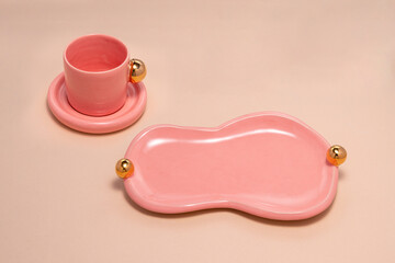 pink porcelain, with a gold handle