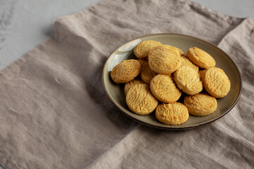 Homemade Cookies with Limoncello and candied lemon paste on a plate. Pasticcini al Limoncello