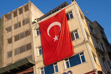  Turkish flag is hanging on the building, symbolizing the housing market in Turkey.