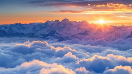 Vibrant winter sunset illuminating snow-covered peaks above misty clouds