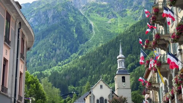church in the mountains in the Alps in Chamonix with flags waving on the sides