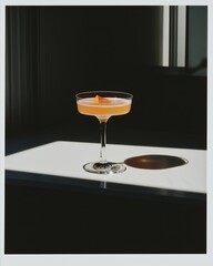 A vintage 35mm photo of a champagne cocktail isolated in a simple scene