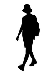 silhouette of a person walking with a backpack and hat