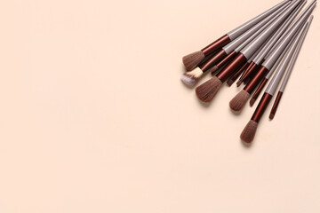 Makeup brushes on pink background