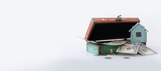 banner on a white background a casket with money and a wooden house.