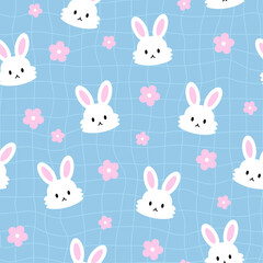 Seamless pattern with cute rabbits on blue background. Vector illustration.