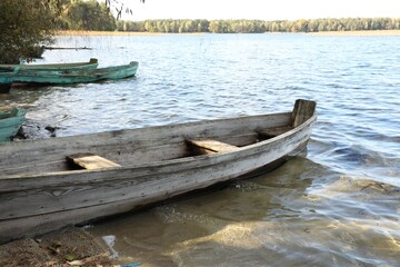 Obraz premium Many wooden boats on river. Water transportation