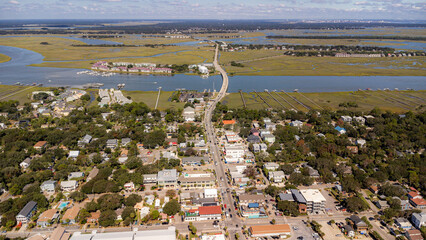 Obraz premium Aerial view of coastal beach town with rivers and Charleston in background