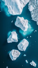 Icebergs floating in the ocean: an aerial view of glacial melt