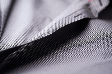 Close up of dark Men's shirt. Soft focus. Copy space.	