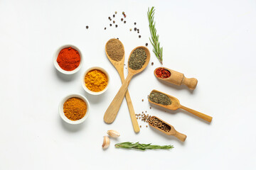 Composition with aromatic spices and fresh rosemary on light background © Pixel-Shot