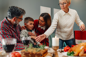 Family celebrating thanksgiving enjoying dinner together at home