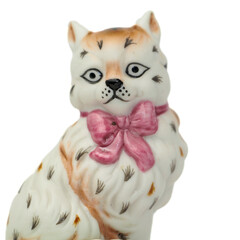 Vintage Porcelain Cat Figurines. Smiling Cat and Cat with Pink Bow. High quality photo