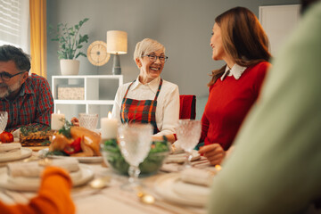 Happy family enjoying christmas dinner together at home