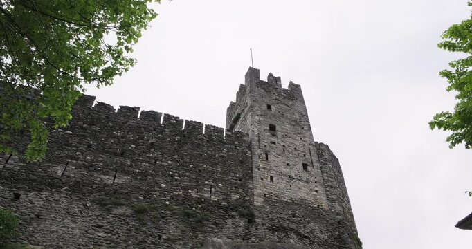 Lake Como, Dervio, Italy. Castle of Corenno Plinio on a cloudy day. Vacations in Italian Alps. Travel destination honeymoon