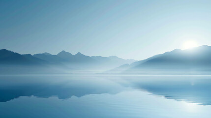Tranquil lake and mountain landscape with a soft blue color palette. The water is like a mirror, reflecting the sky and mountains.