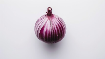 The red onion is placed alone on a pure white background