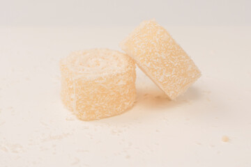 Coconut candy roll isolated on a white background.