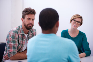 Group, creative and business people in meeting, planning or problem solving in startup office. Collaboration, teamwork or manager brainstorming ideas for public relations, press release or discussion