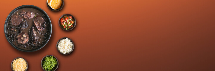 Traditional Brazilian feijoada with a red background