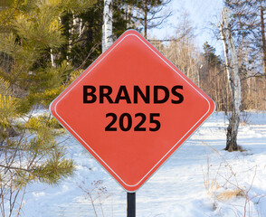Planning brands 2025 new year symbol. Concept words Brands 2025 on beautiful red road sign. Beautiful winter forest background. Business brands 2025 new year concept. Copy space.