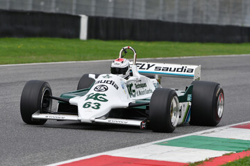 Fototapeta premium Scarperia, Italy - October 12th 2024: Williams FW07C of year 1981 ex Alan Jones drive by unknown in action during practice session at Mugello Circuit.