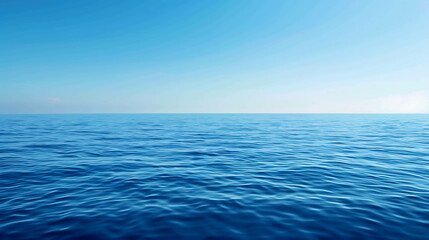 Obraz premium Deep blue ocean with a clear blue sky. The water is calm and there are no waves. The horizon is in the distance.