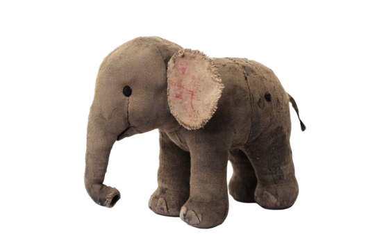 An antique stuffed elephant features tattered fabric with faded colors, exuding a historic charm and nostalgic essence, set in a classic pose to capture enduring appeal.