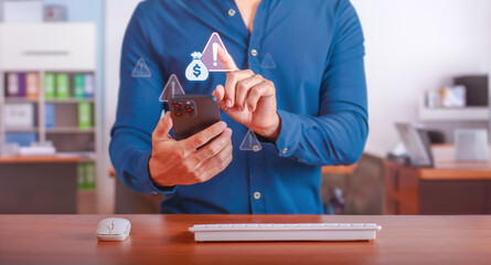 Investment Risk Warning. Businessman receiving caution alert for financial investment on mobile device in modern office. Concept of financial risk management and strategic decision making