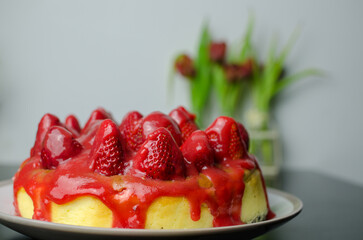 Baked strawberry cheesecake with fresh strawberries from the garden and dripping coulis, slice of cake
