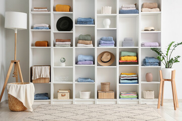 Modern wardrobe with stylish autumn clothes and accessories