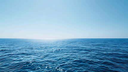 Obraz premium The deep blue sea stretches out before you, endless and mysterious. The only sound is the gentle lapping of the waves against the shore.