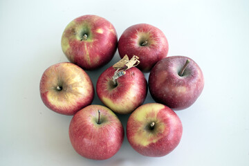 red apples on a wooden table
