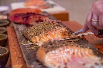 Freshly sliced smoked salmon with herbs, gourmet buffet, culinary presentation at holiday event, Shanghai, China, December 24, 2019