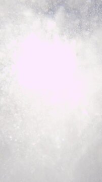 SLOW MOTION: Pro snowboarder riding the half pipe in big mountain snow park, sliding and spraying snow on the halfpipe wall in sunny winter. Extreme snowboarder snowboarding and performing tricks.